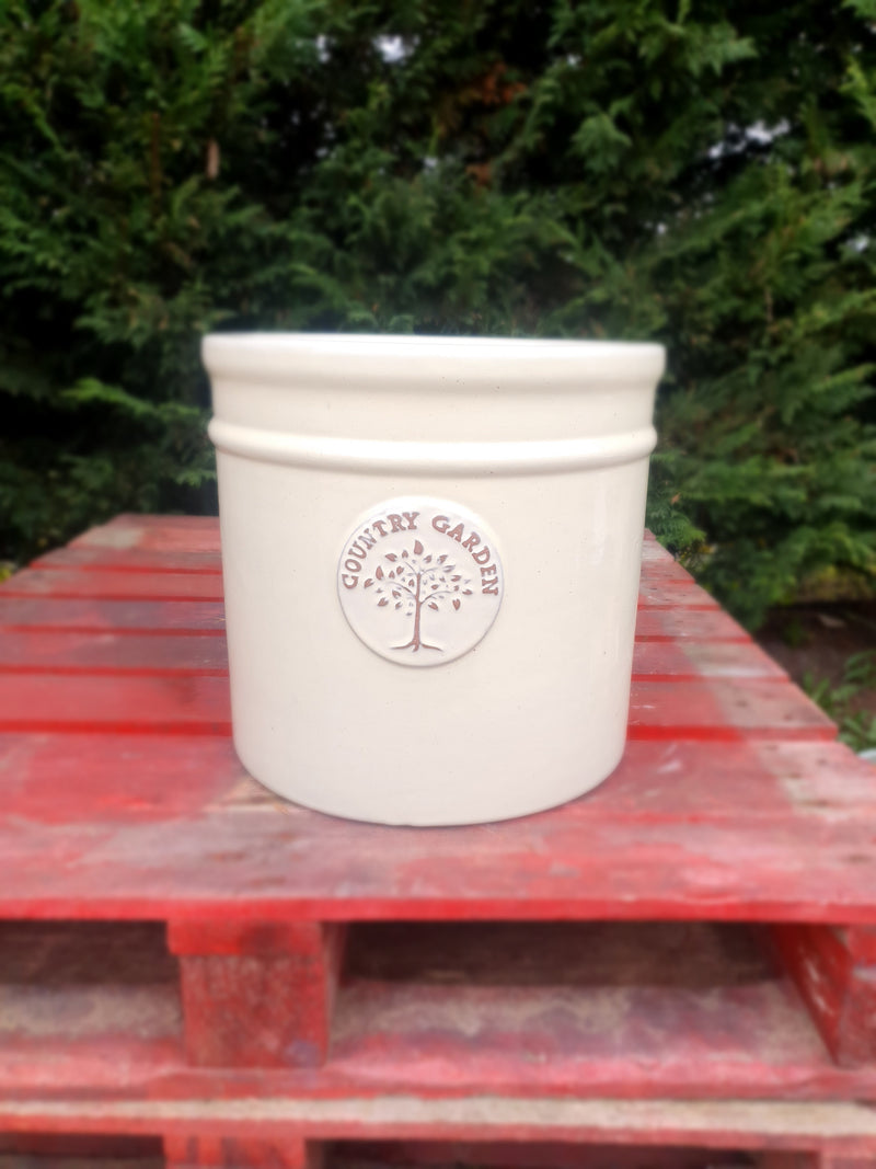 Cream Glazed Cylindrical Pot With Tree Emblem