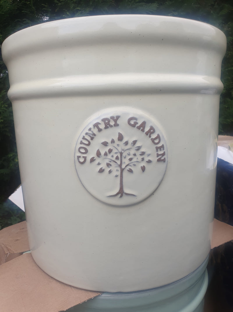 Cream Glazed Cylindrical Pot With Tree Emblem